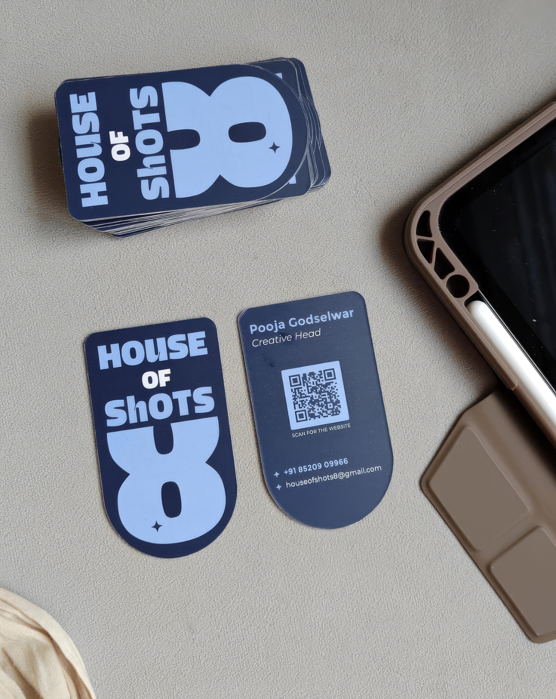 House of Shots 8 business cards — die-cut in the shape of the 8 mark, printed in navy